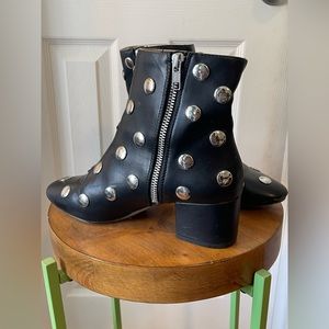 Black heeled boots with silver studs
